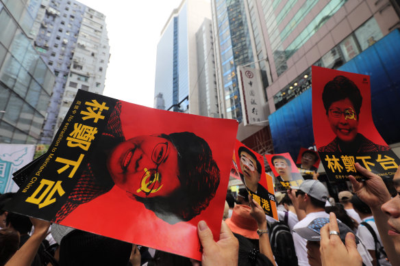 Protesters at the June 9 march with posters of Carrie Lam.