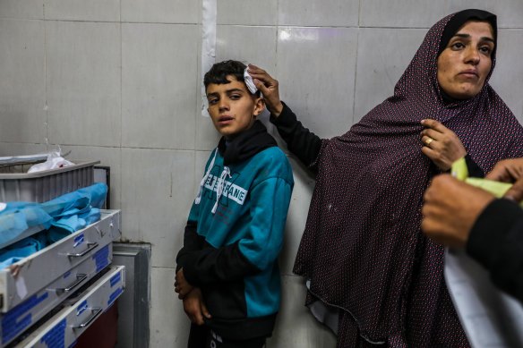 Palestinians injured in an Israeli airstrike arrive at Nasser Medical Hospital in Khan Younis, Gaza.