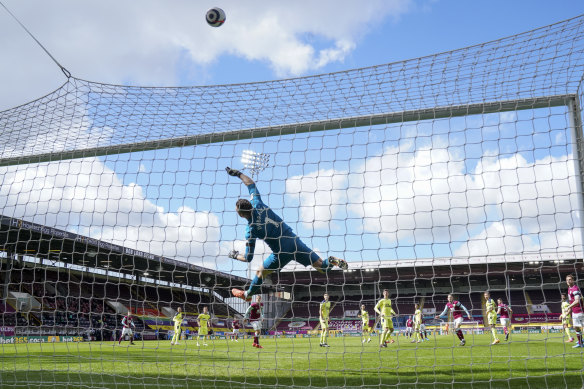 Newcastle’s goalkeeper Martin Dubravka tips a Burnley shot on goal over the net at Turf Moor on Sunday.