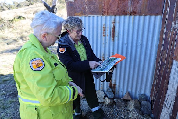 NSW Heritage Minister Penny Sharpe and NSW National Parks and Wildlife Service project officer Megan Bowden visiting Four Mile Hut in May after 10 huts destroyed were rebuilt.