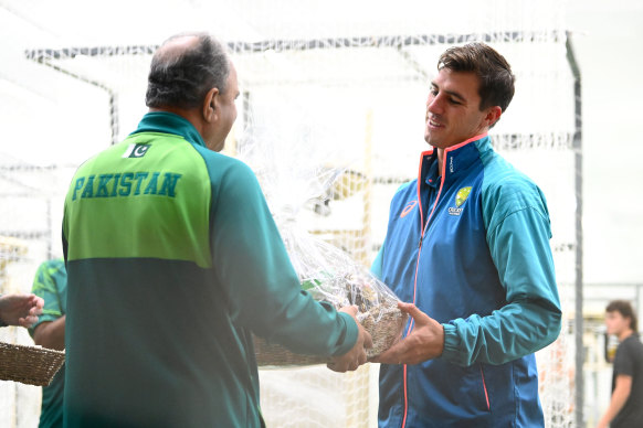 Christmas spirit: The Pakistanis came armed with gifts before the Test.