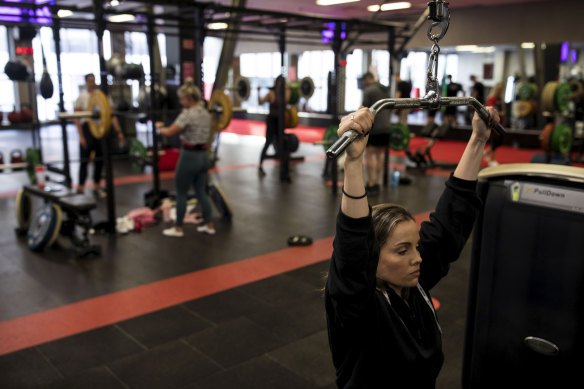 People work out at a Fitness First at Bondi Junction on Saturday as gyms reopen.