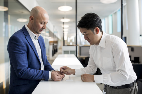 Medicision founders Dr Joshua Chou and associate professor Steven Bernardi demonstrate a rapid antibody test which can detect the COVID-19 antibody within 10 minutes.