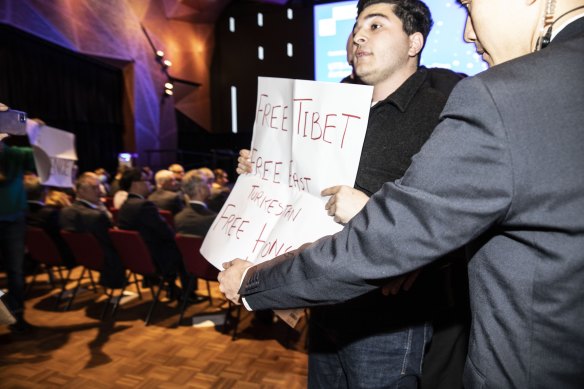 Protesters disrupted a speech by China’s ambassador Xiao Qian in Sydney on Friday.