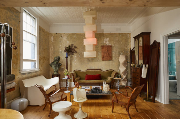 Mooney created the aged wall patina in his lounge by scraping back layers of paint. The vintage “Akari” paper lanterns are by Noguchi.