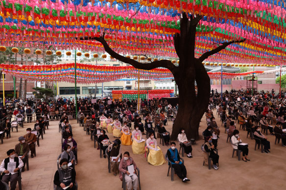 Koreans observe social distancing as they gather to celebrate Buddha's birthday and pray for the defeat of the coronavirus pandemic at Jogyesa Temple in Seoul, South Korea. 