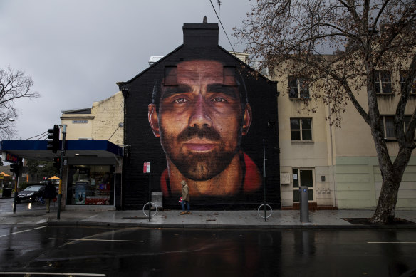 A nearby mural of former Sydney Swans player Adam Goodes, also faciliated by Apparition Media.