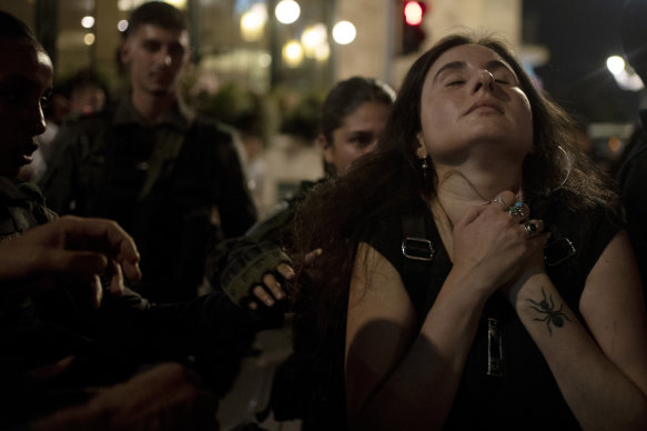 A protester near Israeli Prime Minister Benjamin Netanyahu’s official residence after the release of the video.