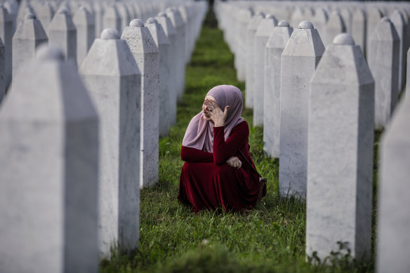 A Bosnian Muslim woman cries at the graves of relatives in Srebrenica on the anniversary of the massacre.