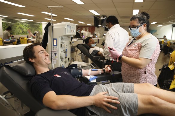 More Australians will be able to give blood after changes to eligibility. Marlon Skeldon gives blood in Sydney CBD earlier this month.