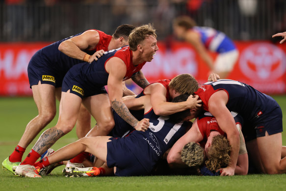 A euphoric Demons side celebrates.