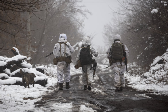 Ukrainian soldiers walks at the line of separation from pro-Russian rebels near Katerinivka, Donetsk region, Ukraine.