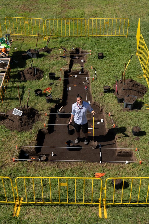 Nicholas Galanin with his work, Shadow of the Land on Cockatoo Island. 