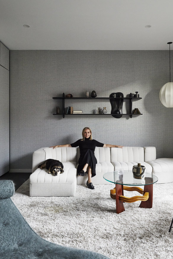 Tanya Hansen with her dog, Rosie, in the formal lounge. “I sit here at night and think, ‘How I love this place,’ ” she says. “Simone and Cindy have created a home that I adore.”