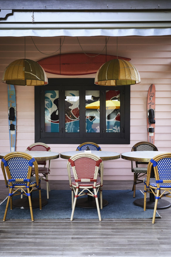 “The back verandah gets a big workout,” says Delany. The exterior paint colour is “Bunny Soft” by Dulux and the chairs are from Leonard Joel Auctions.