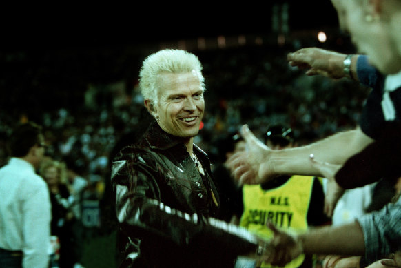 Idle moments: Billy Idol leaves the stadium after a power failure ended his performance