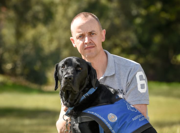 Stuart Wright and his assistance dog Frankie.
