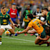 Joseph-Aukuso Suaalii of the Wallabies offloads.