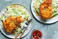 Crumbed pork cutlets with hot honey and summer slaw.