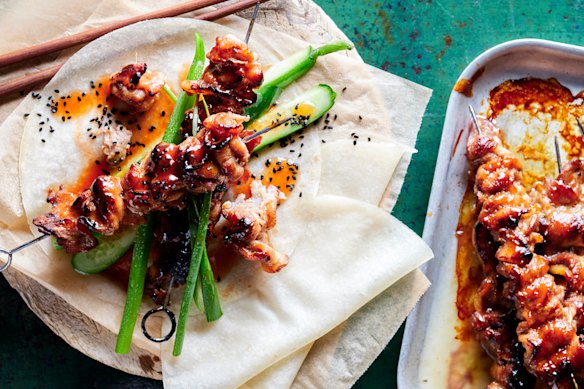 Char sui pork skewers with cucumber and sesame salad.