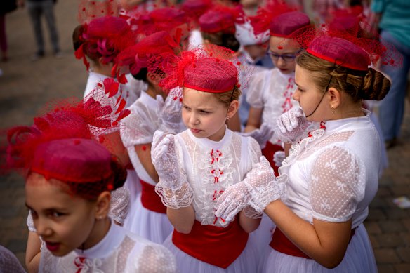 Students of a dance school wait outside Romania’s Palace of Parliament during a series of events marking International Children’s Day in Bucharest, Romania.