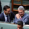 Labor MP Josh Burns consoles Mark Dreyfus after he spoke during a condolence motion for the victims of the Bondi antisemitic terror attack.