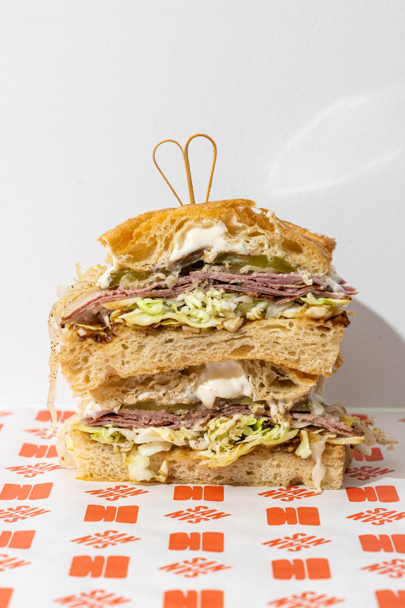 The pastrami sandwich with cabbage, pickles and onion jam. 