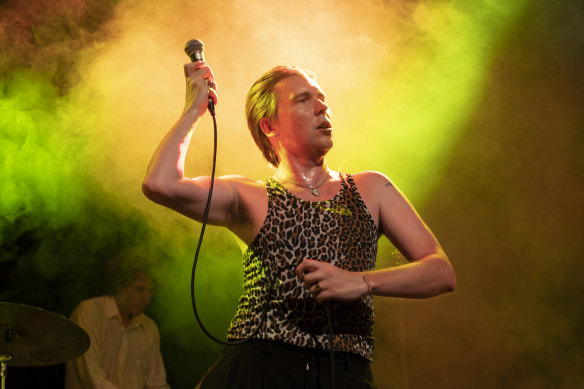 Alex Cameron performing in
Sydney in late 2022. He says fans come to see him “create a spectacle on the knife’s edge” while he sings about the “table-for-one guy” starved of purpose.