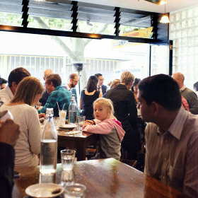 The dining room opens up onto the street. 