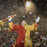 Carnival revelers attend the “Urknall,” or Big Bang, which occurs at Kapellplatz at five in the morning and marks the start of the Lucerne carnival Thursday in Lucerne, Switzerland.
