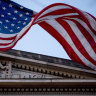 An American flag flies outside the Department of Justice in Washington.