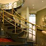 The entryway to 262 Hawthorne Parade is dominated by a sweeping staircase.