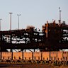 An iron ore train departs the BHP Billiton port facility