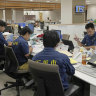 Officials of Ishigaki city, Okinawa prefecture, gather at the city hall in response to a missile alert. 