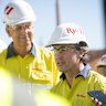 Simon Trott, flanked by Jakob Staustholm, at Rio Tinto’s Western Range mine in June.