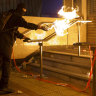 A molotov cocktail in use.