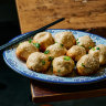 Sheng jian bao (pan-fried pork buns) are a signature at Hong’s Dumplings.