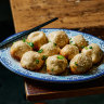 Sheng jian bao (pan-fried pork buns) are a signature at Hong’s Dumplings.