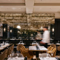The ground-floor restaurant at Maison Batard has smoked-glass mirrors, plump velvet seats and a custom-built oyster bar.
