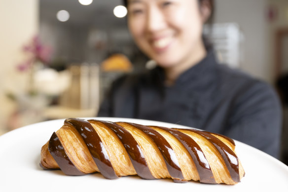 Co-founder Frances Song with a chocolate bar croissant at Moon Phase in St Leonards.