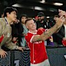 James McClean takes a selfie with fans after his side’s clash at Marvel Stadium.