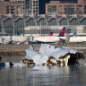 The remains of the American Airlines flight from Wichita, Kansas, which collided midair with a military Black Hawk helicopter.