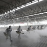 Firefighters conduct disinfection on the platform at a railway station before Wuhan's transport networks reopened in March. 