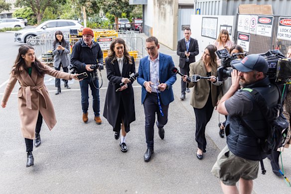 Minister for Tourism, Sport and Major Events Steve Dimopoulos (centre) arrives ahead of the Labor caucus meeting.