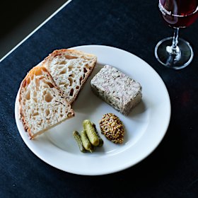 Pork terrine with pickles, mustard and bread. 