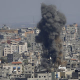Smoke rises from a building in Gaza City after an Israeli air strike.