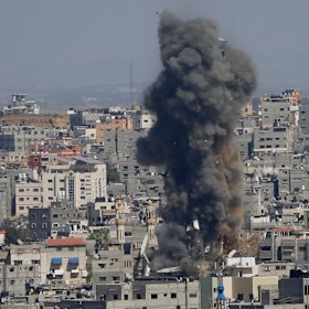 Smoke rises from a building in Gaza City after an Israeli air strike.