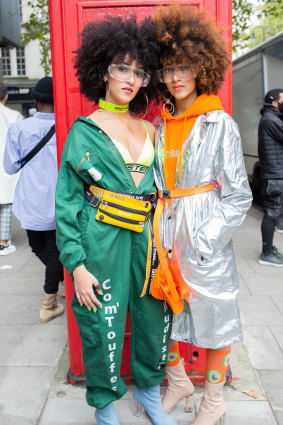 Twin sisters Sarah and Sabrina Guessab, bloggers and stylists from Paris outside The Store Studios for London Fashion Week.