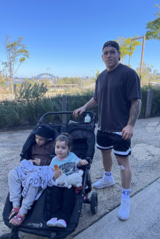 Cameron McInnes with his children, Noa and Mia, at Taronga Zoo on Sunday.