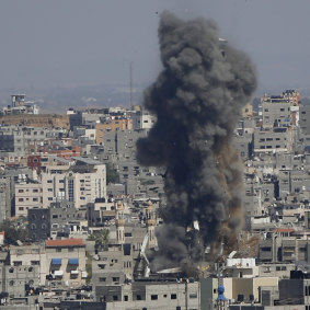 Smoke rises from a building in Gaza City after an Israeli air strike.